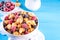 Tiny breakfast croissant cereals with fresh berries and milk