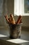 Tiny bucket with cinnamon sticks on rustic wooden background