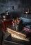 Tiny bucket with cinnamon sticks on rustic wooden background