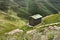 A tiny building next to a steep abyss in the Drakensberg mountains of Lesotho and South Africa.