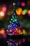 tiny Christmas tree made of glass as decoration for New Year holidays, forest, winter season