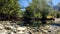 tiny clear cold stream with shingle stones in Arkhyz mountains - photo of nature