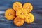 Tiny decorative orange pumpkins with textured background