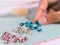 tiny gems of red, blue, yellow and their combinations. commonly used for jewelry
