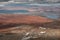 Tiny hiking person in landscape of Pieljekaise National Park in autumn with lakes and mountains in Lapland in Sweden