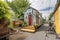 tiny home in quaint town, surrounded by bustling activity and shops