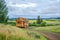 A tiny home on wheels in a picturesque landscape.