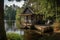 tiny house with wraparound porch and rocking chair on a serene lake