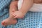 Tiny legs and feet of newborn baby girl