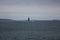 Tiny Lighthouse in Vast Ocean (Landscape)