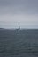 Tiny Lighthouse in Vast Ocean (Portrait)