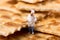 Tiny little figure of a chef in a cracker biscuit