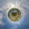 tiny planet in sky with clouds overlooking above on empty stadium or sports complex. Transformation of spherical 360 panorama in