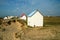 The tiny white beach cottages with colorful roofs