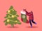 Tiny Woman with Huge Xmas Sock with Gift Box. Girl Carry Present near Fir Tree. Christmas and New Year Celebration