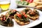 tip view of bruschetta with spinach and grilled artichokes