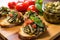 tip view of bruschetta with spinach and grilled artichokes