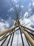 Tipi poles and Cloudy Sky