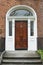 A tipical brownwooden door in Dublin of a victorian house