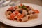 Tipical sud italian dish with swordfish capper tomato basil oliva oil mediterranean food