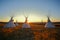 Tipis at sunrise on the prairie