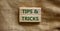 Tips and tricks symbol. Wooden blocks with words \\\'Tips and tricks\\\'.