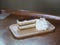 TIRAMISU Cream cheese Cake piece with Whipped Cream on wooden plate