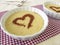 Tiramisu cream with heart from cocoa powder