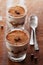 Tiramisu in glass on vintage table, traditional coffee flavored Italian dessert