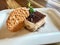 Tiramisu Pudding with Biscuits and Cocoa Powder served at Restaurant / Turkish Muhallebi with Biscuits.