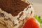 Tiramisu. Traditional italian dessert on wooden plate