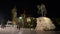 Tirana city centre, Skanderbeg square by night. Skanderbeg statue, Et`hem Bay Mosque, clock tower and Albanian flag in Tirane. She