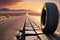 Tire Abandoned on a Desolate Highway - Positioned Upright with Its Tread Facing the Viewer, Distant Horizon