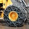 Tire chains on very large tire.