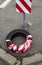 Tire cover wrapped in red and white safety strip