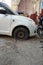 Tire leak, close up wheel of old white vintage car. Car wheel flat tire on the road. Deflated the tyre of an old car next to a