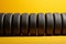 Tire lineup Row of tires presented on a vibrant yellow background