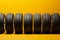 Tire lineup Row of tires presented on a vibrant yellow background