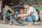 Tire repairman lights a fire with a lighter on a traditional press while patching a motorcycle tire