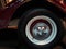 Tire and rim of a vintage car. Shiny and polished wheel of an old car. Exhibition cars