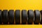 Tire row elegance Yellow background adorned with a neat row of tires