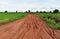 Tire track of many vehicle on soil mud road in countryside in rainy season