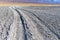 Tire tracks through the Alkali flats of dry Owens Lake near Keeler, California, USA