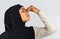 Tired afro muslim woman in hijab touching her nose bridge