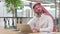 Tired Arab Businessman with Laptop having Neck Pain