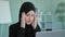 Tired Arabian Muslim Islamic woman in black hijab female worker student take short pause in online work feeling headache