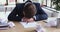 Tired businessman ceo sleeping at messy office desk with papers