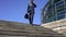 Tired businessman with suitcase talking on phone with partner, going down stairs