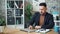 Tired businessman working with laptop in office then sleeping resting on desk