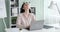 Tired businesswoman working on laptop at office desk